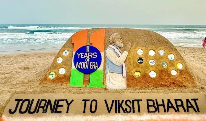 Odisha News:Sand-Artist-Sudarsan-Patnaik-Celebrates-11-Years-of-Modi-Govt-with-Stunning-Sand-Art